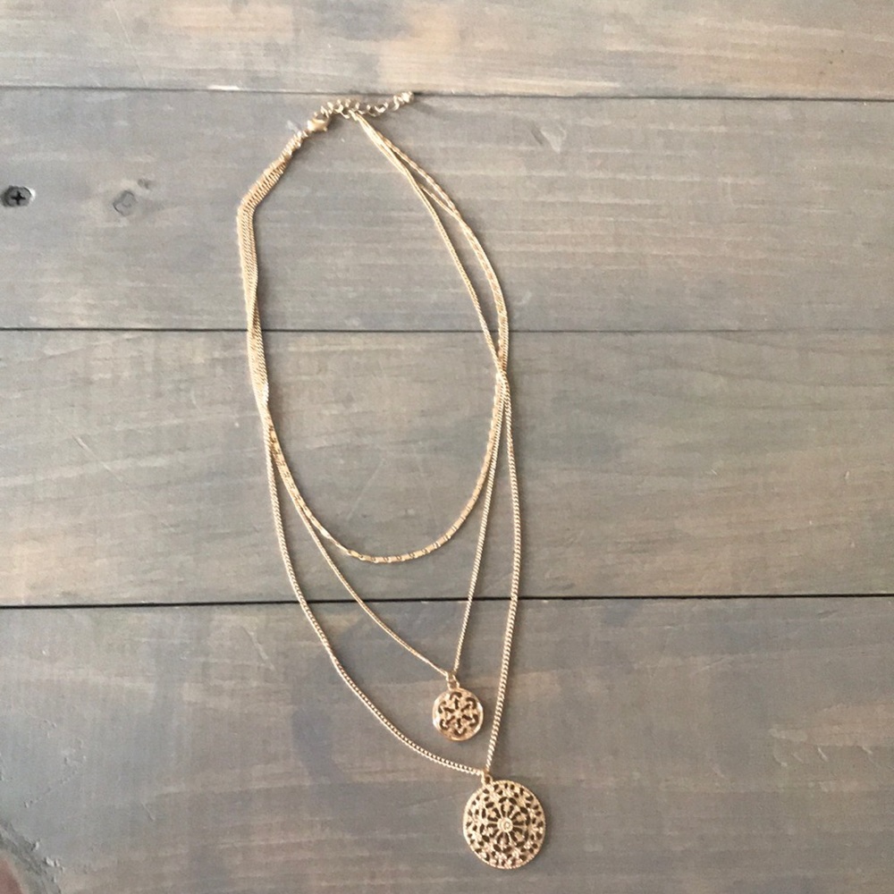 Gold colored necklace
